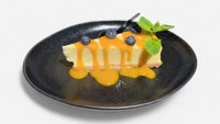 Objednať Cheesecake vanilkový s mangovým coulis