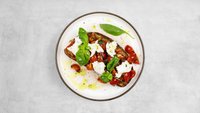 Objednať BRUSCHETTA CON BUFALA, POMODORINI E PROSCIUTTO CRUDO