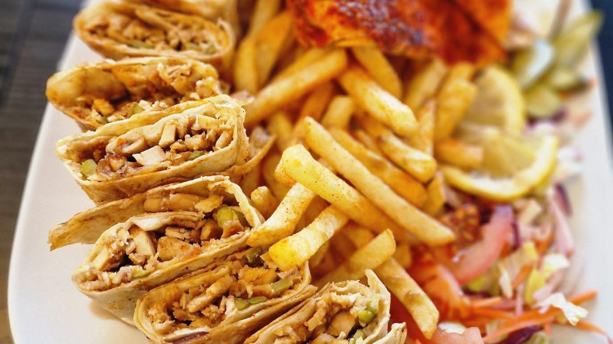 Shawarma and fries on a plate.