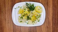 Objednať Vařené brambory s máslem a bylinkami