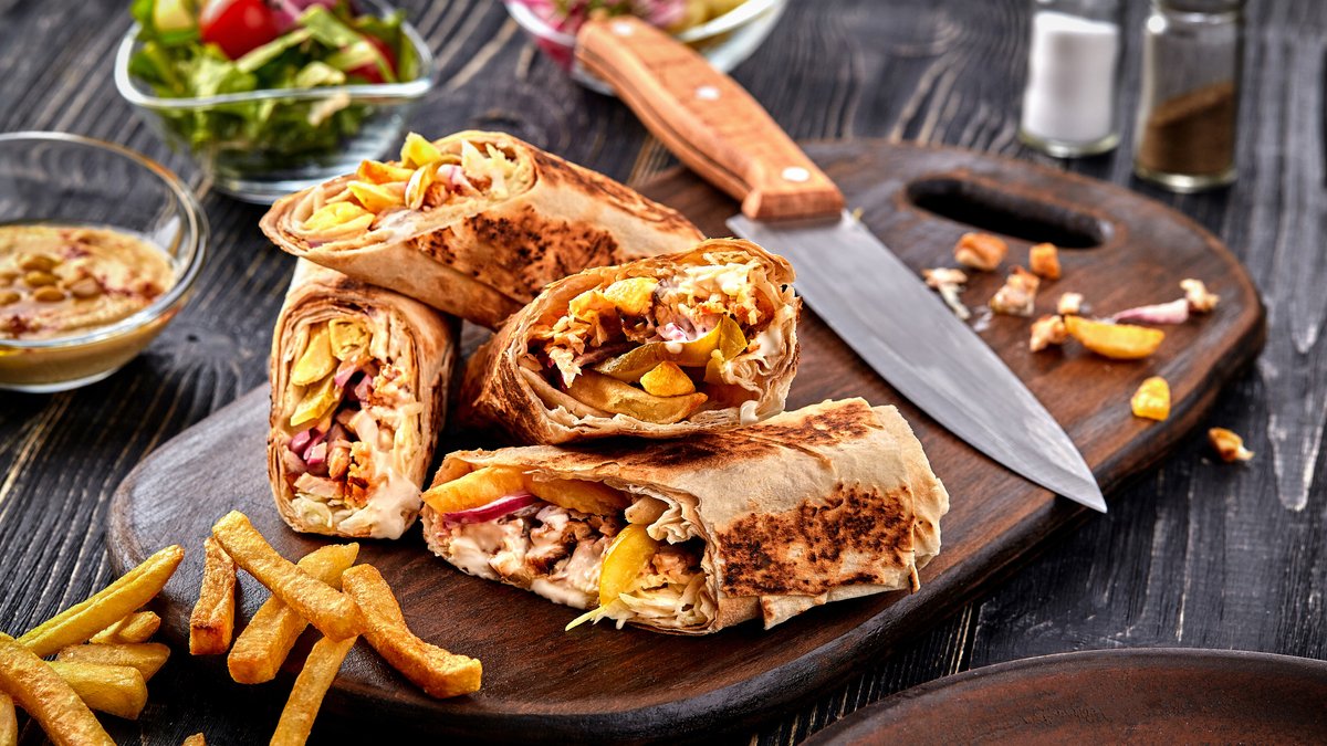 Shawarma on a wooden platter.